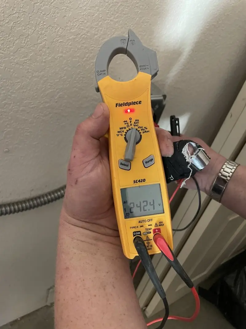 Voltage testing with clamp meter during Generator Installation in Pine Grove